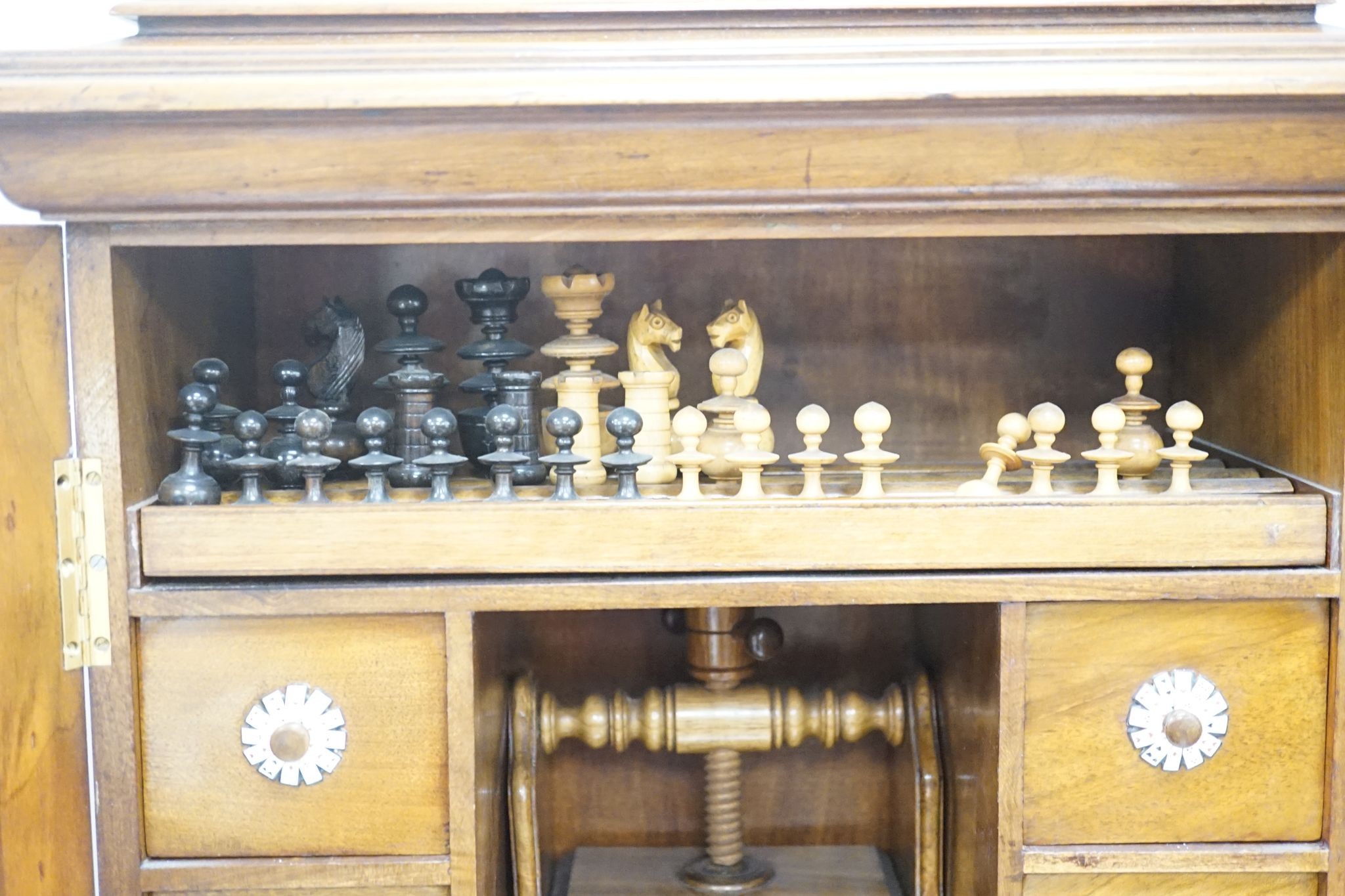 A late 19th century gilt metal mounted walnut games cabinet, W.40cm D.19cm H.49cm